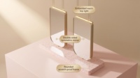 Vitrine de salon de beauté ovale illuminée sur mesure avec miroir à bord doré et comptoir en pierre pour salon de coiffure