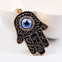 Porte-clés main Hamsa en émail à la mode exquis avec porte-clés de décoration de sac en alliage incrusté de strass de conception du mauvais œil