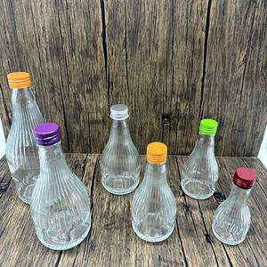 <span class=keywords><strong>Botellas</strong></span> <span class=keywords><strong>de</strong></span> Vidrio Transparente <span class=keywords><strong>de</strong></span> Grado Alimenticio con Rayas Horizontales, <span class=keywords><strong>de</strong></span> 100ml a 700ml, con Tapa Metálica <span class=keywords><strong>de</strong></span> Rosca para Jugos y Bebidas - Product Image 4