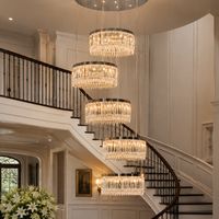 Lustre en cristal multi-anneaux pour escalier, luminaire suspendu en métal noir pour hall de villa à plafond haut