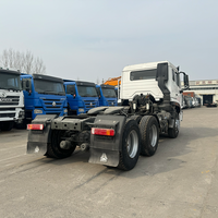 Тягач Howo NX 6x4 б/у, Евро-2, лево-/праворульный, 371/380 л.с., дизель, с камерой заднего вида, для перевозки контейнеров до 30 тонн