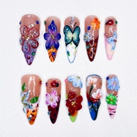 Nouveauté 2025 : Faux ongles à presser faits main, style exquis, motif fleur et papillon violet, longueur moyenne, amovibles, pour un look tendance