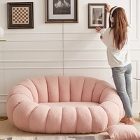 Fauteuil lounge pivotant en forme de citrouille blanc crème avec repose-pieds