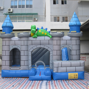 Château gonflable dinosaure avec toboggan pour location de fête - Product Image 1