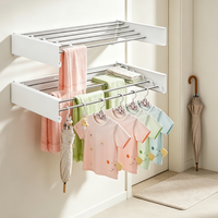 Lavinia – Support mural rétractable moderne et durable en acier inoxydable noir, pliable à trois niveaux, multifonctionnel pour cuisine et vêtements