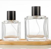 Bouteille de parfum vide en verre carré de luxe de 50ml 100ml avec bouteille de parfum rectangulaire à bouchon rond noir