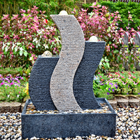 Sculpture en pierre magique populaire en Europe, fontaine en granit naturel sculptée à la main, design contemporain pour l'extérieur, résistante au feu et à l'eau