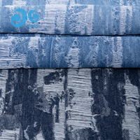 Jean en denim jacquard effet vieilli, aspect déchiré 3D, trame apparente, style vintage urbain, personnalisable OEM, faible MOQ