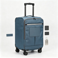 Valise souple pliable à roulettes en tissu bleu avec poches organisatrices frontales, poignée télescopique et protections d'angle