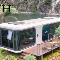 Capsule spatiale préfabriquée sur mesure, maison conteneur moderne, cabane modulaire portable, pod de glamping avec cuisine et chambre pour complexe hôtelier