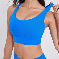 Soutien-gorge de sport uni sans bretelles à dos croisé, maintien moyen, respirant, léger, rembourré, antichoc, extensible dans quatre directions pour femme