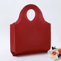 Sac fourre-tout en non-tissé épaissi avec poignée à trous ronds, sac cadeau de boutique haut de gamme, sac de rangement réutilisable pour exposition, vente en gros