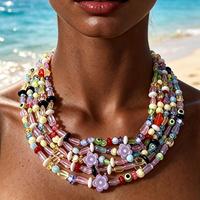 Collier bib multicouche en perles de verre fait main, avec perles œil et fleur de couleurs mélangées, style bohème