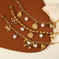 Ensemble de bijoux fantaisie deux pièces pour femme, plaqué or, en alliage de zinc, avec bracelets à breloques géométriques et bague style spirale anti-moustiques