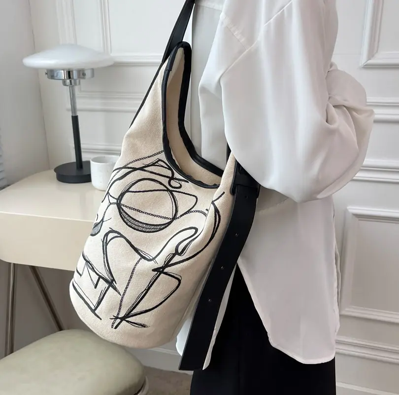 Bolso de mano de lona con cremallera para mujer, bolsa de mano a la moda con grafiti de alta calidad, estilo contraído, a rayas, contraste de Color, logotipo impreso personalizado