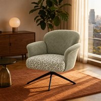 Fauteuil de salon texturé avec coussin botanique, base pivotante en métal noir, hauteur réglable