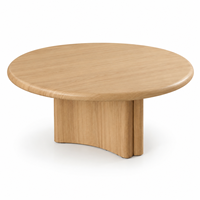 Table basse ronde en chêne moderne avec base sculpturale pour salon