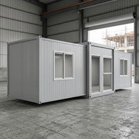 Maison conteneur extensible de 20 pieds à double aile, préfabriquée, modulaire, gris industriel, pour bureau, dortoir ou usage sur chantier