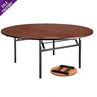 Table pliante ronde en bois ignifuge Sino Perfect pour hôtels, banquets, mariages, avec pieds pliables et plateau en contreplaqué PVC