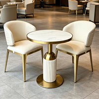 Ensemble table et chaises de salle à manger ronde pour hôtel et restaurant, plateau en pierre frittée, structure en acier inoxydable doré, table de café et salon de luxe avec 4 chaises