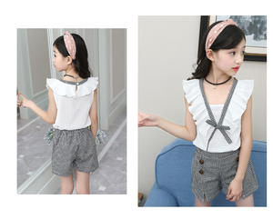 Nouveaux vêtements pour enfants en gros, mode indienne, ensemble haut sans manches en coton blanc avec nœud et short à carreaux pour fille - Product Image 2