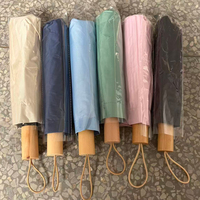 Parapluie de voyage pliable en 3 sections avec poignée en bois de couleur unie de haute qualité, personnalisable avec logo, vente en gros