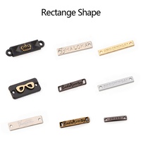 Fabricant de matériel personnalisé vente en gros alliage de zinc marque personnalisée logo design placage étiquette en métal pour vêtements