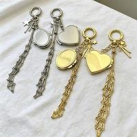 Élégante boîte de rangement pour rouge à lèvres en acier inoxydable, forme cœur et ovale, couleur or et argent, avec miroir, pochette en maille et pendentif porte-clés