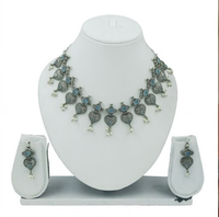 DIVYORO Ensemble collier et boucles d'oreilles en argent oxydé avec pierre bleue motif feuille pour femme, idéal pour les fêtes et les fiançailles, pendentif de créateur classique