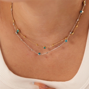 Collana Girocollo Bohemia Designs in Acciaio Inossidabile Placcato Oro con Perline Occhio Blu e Catena a Maglie per Donne - Product Image 1