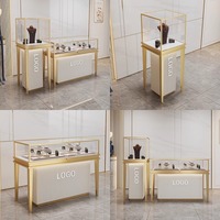 Vitrine de présentation pour lunettes et bijoux de haute qualité en acier inoxydable doré avec éclairage LED et vitrine en verre étanche