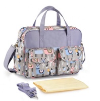 Sac à langer tendance en polyester imperméable à imprimé licorne, grande capacité, avec matelas à langer amovible et poches pour biberons
