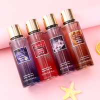 Brume parfumée pour femme, cylindrique, dégradé violet, capuchon doré, étiquette florale, boîte de présentation étoile de mer, fruitée, longue durée