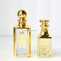 Vente en gros de carafe d'huile de parfum en verre de luxe arabe classique 150ml Uv plaqué or décoratif Attar Display