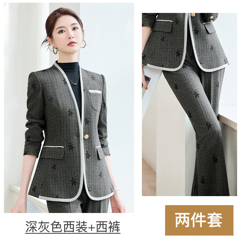 Dark gray suit with slightly flared trousers and belt