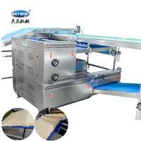 Machine à laminage continu de pâte avec système d'arrosage pour la production de biscuits soda et de biscuits en forme de panda