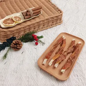 Vente en gros de viande sèche de canard enveloppé de bâtonnets de cuir brut en triangle friandises naturelles saines pour animaux de compagnie Fabricant d'aliments pour animaux de compagnie