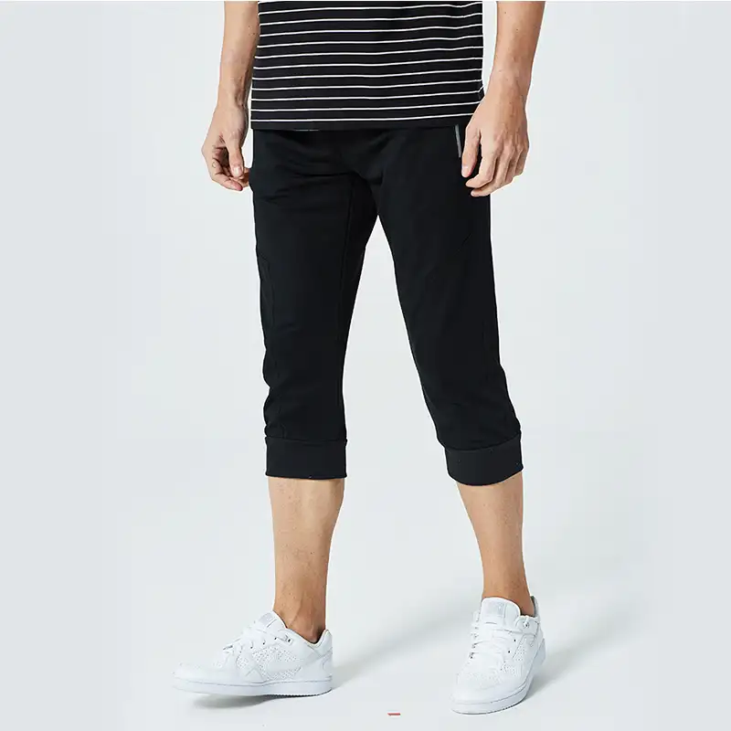 2019 zwart/wit nieuwe bijgesneden broek mannen casual elastische trekkoord taille mannen driekwart broek zweet broek