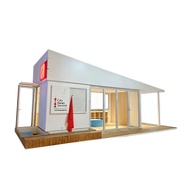 Maison conteneur préfabriquée unique à toit triangulaire blanc, bâtiment modulaire à ossature en acier pour bureau, boutique et hébergement