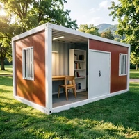 Maison modulaire en conteneur avec structure en acier robuste et fenêtres sécurisées pour le logement d'un bureau de chantier