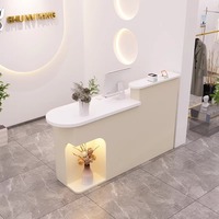Comptoir de caisse rond en arc de style crème pour magasin de vêtements, petit comptoir lumineux pour salon de beauté, table de réception