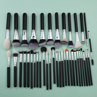 Ensemble de pinceaux de maquillage à manche en bois noir professionnel cheveux naturels de qualité supérieure 40 pièces outils cosmétiques portables Odm/Oem