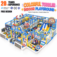 Nouveau 2026 Aire de jeux intérieure pour enfants, thème spatial coloré, avec piscine à balles, tunnel d'escalade, structure planète fusée et ensemble de toboggans personnalisé