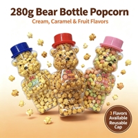 Grand bonbon en bouteille en forme d'ours, pop-corn crémeux au caramel et aux fruits, disponible en trois saveurs. Non-OGM. Sans graisses trans. Emballage personnalisable.
