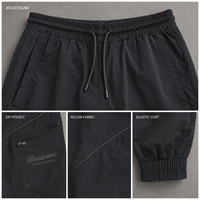 Pantalon de jogging pour homme OEM en nylon avec cordon de serrage à la taille, poche cargo zippée, revers élastiques, coutures courbées, style streetwear décontracté