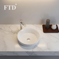 Vasque de salle de bain moderne en céramique ronde à poser sur comptoir, avec options style ferme et salle à manger, en porcelaine haut de gamme pour usage hôtelier