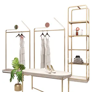 Luxe Winkel Armaturen Gold Kleding Display Stand Led Light Kledingrek Met Marmeren Afwerking Basis