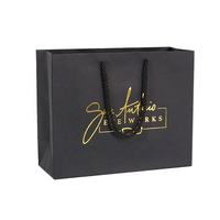 Sacs en papier d'emballage de luxe pour cadeaux, sacs de shopping en carton avec logo personnalisé, sacs de vêtements noirs pour la vente au détail, avec poignée en ruban