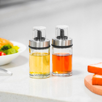 Bouteille de vinaigre d'huile en verre de 100ml avec couvercle en acier inoxydable couvercle à pression transparent bec anti-goutte cuisine conception hygiénique