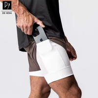 Dubbellaagse sport shorts voor heren met ingebouwde telefoonvak, ademend mesh, geschikt voor gym, hardlopen en fitness, casual shorts